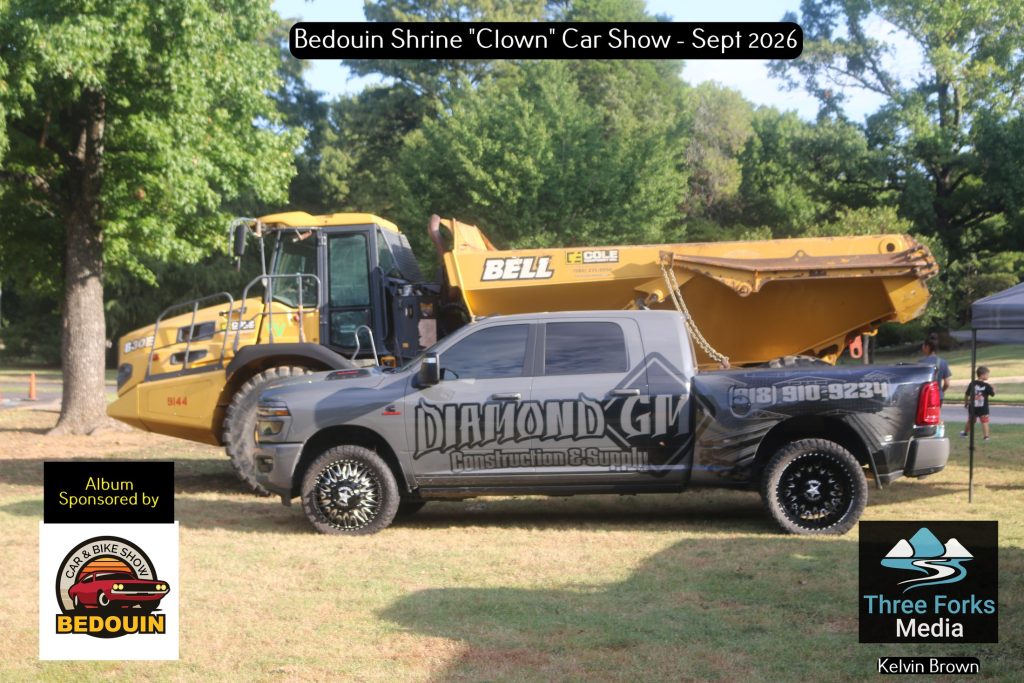 Diamond GM Construction truck and large Bell articulated dump truck at the Bedouin Shrine Car Show